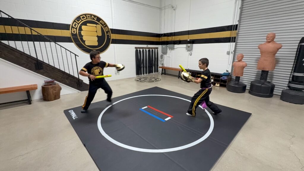 Kids practicing partner drills at Golden Fist martial arts in Burbank.